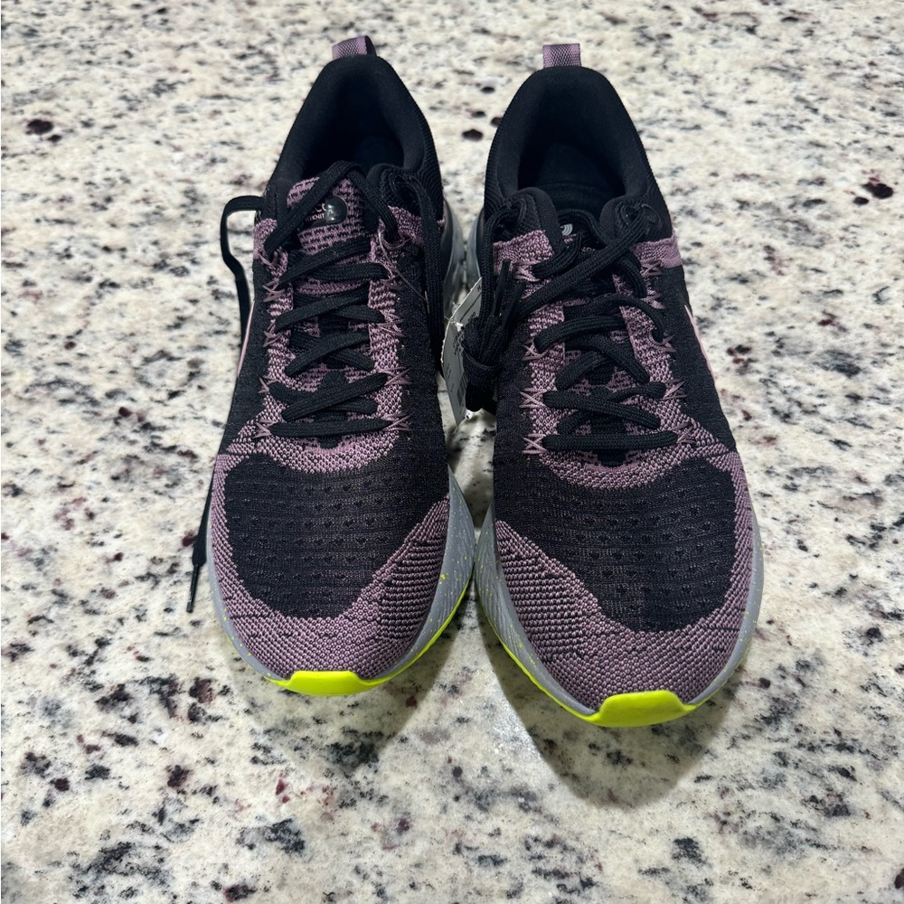 New Women’s Nike react sneakers, size 9m. 
Color black, purple, green, gray